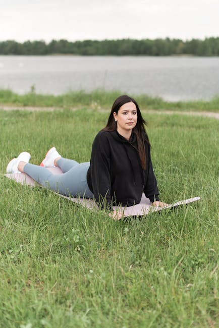 Woman practicing yoga outdoors in a serene and peaceful environment